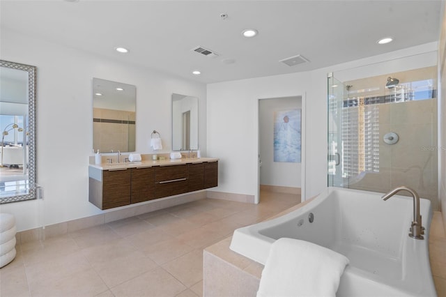 bathroom with vanity, tile patterned floors, and independent shower and bath