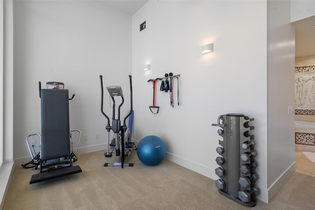 exercise room with carpet flooring