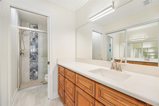 bathroom featuring vanity, toilet, and walk in shower