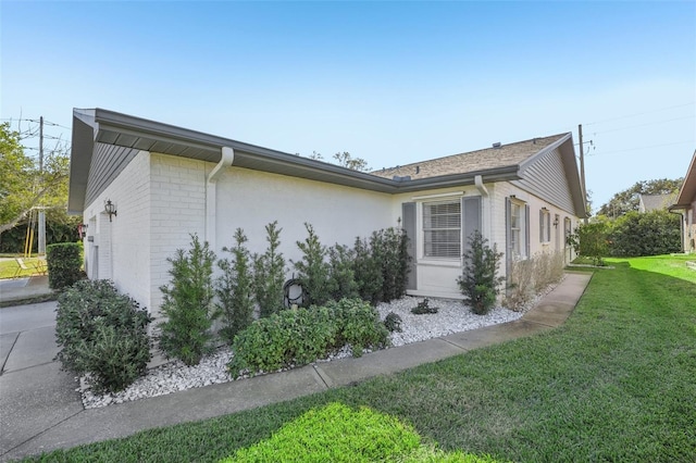 view of home's exterior with a lawn