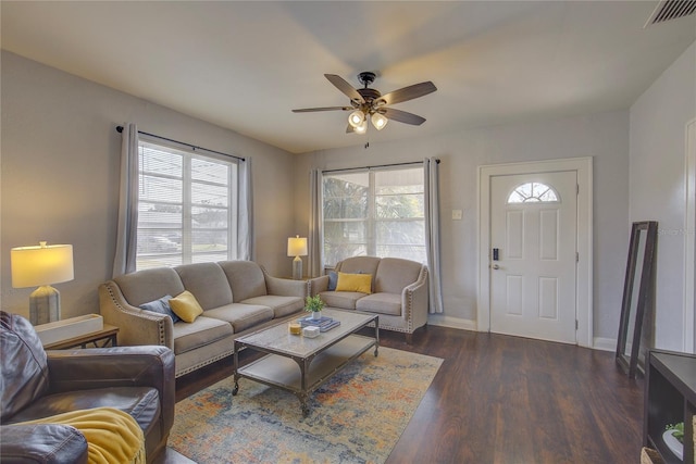 living room with ceiling fan, dark hardwood / wood-style flooring, and a wealth of natural light