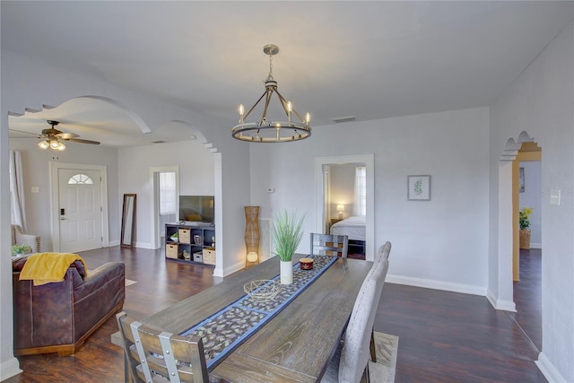 dining room with dark wood-type flooring and ceiling fan