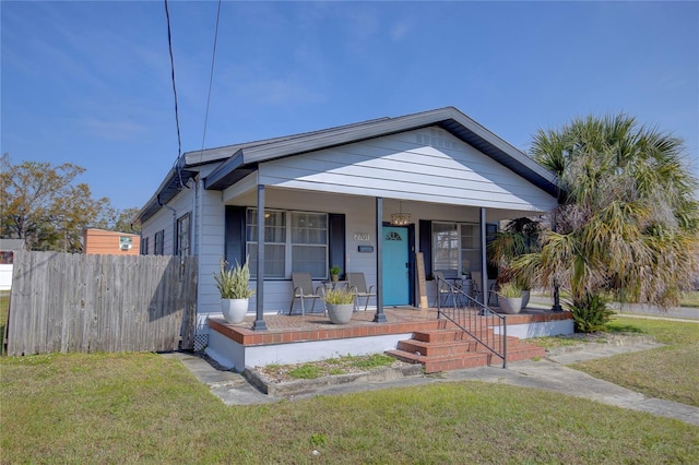 bungalow-style house featuring a front yard and a porch