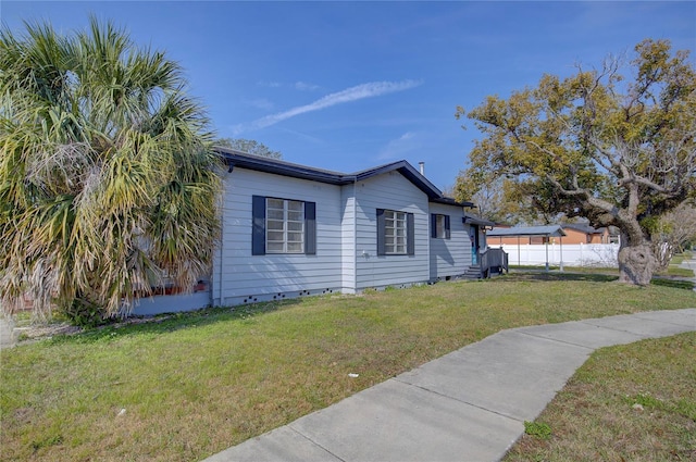 view of property exterior with a lawn