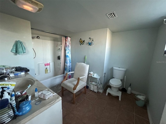 full bathroom featuring tile patterned floors, vanity, shower / bath combination with curtain, and toilet