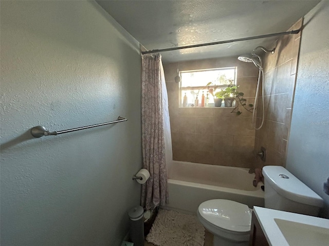 full bathroom with vanity, toilet, and shower / tub combo with curtain