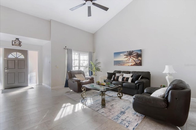 living room with high vaulted ceiling and ceiling fan