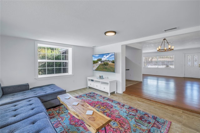 living room featuring a chandelier