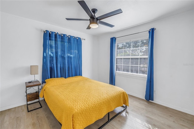 bedroom featuring ceiling fan and wood-type flooring