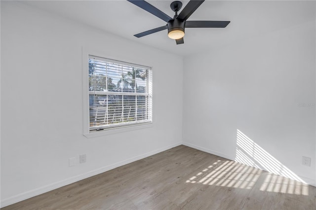 unfurnished room with ceiling fan and light wood-type flooring