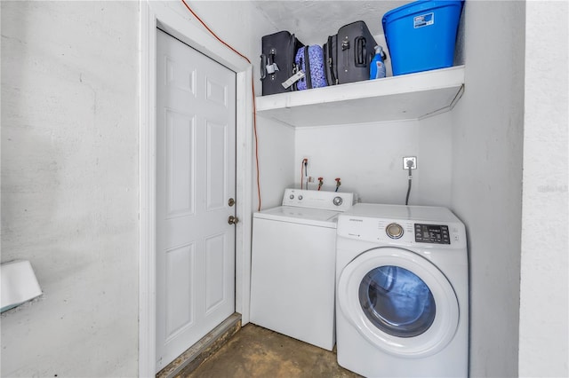 clothes washing area with washer and dryer