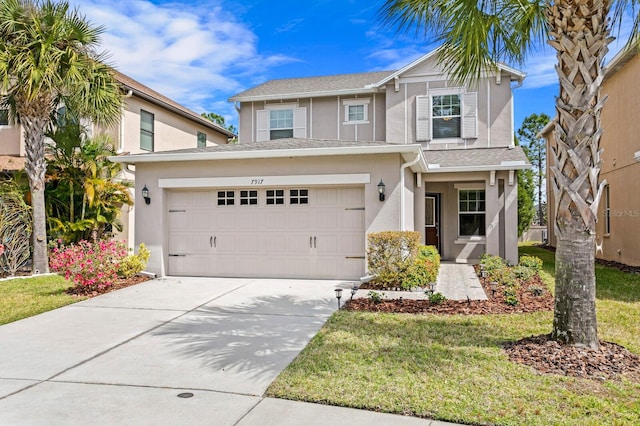 view of front property with a front yard and a garage