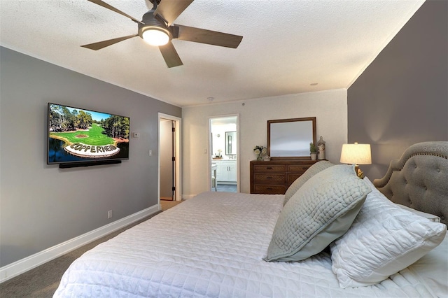 bedroom with carpet flooring, ceiling fan, and ensuite bathroom