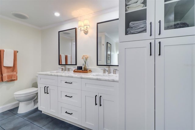 bathroom featuring tile patterned floors, vanity, toilet, and ornamental molding