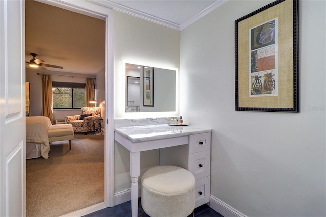 bathroom with ceiling fan and ornamental molding