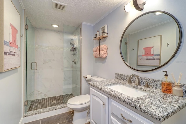 bathroom with tile patterned floors, crown molding, a shower with shower door, and a textured ceiling