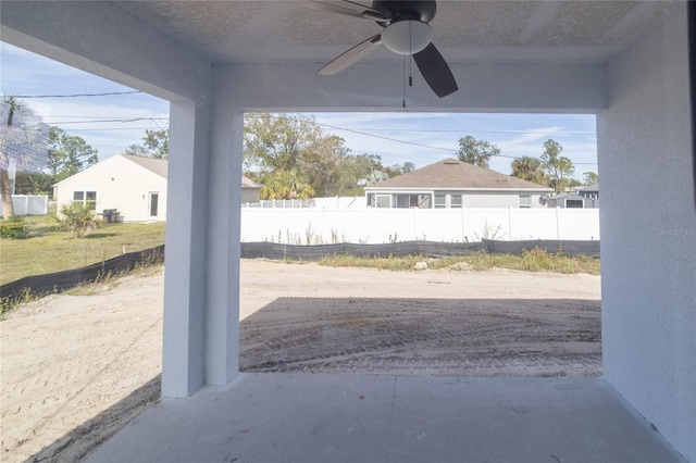 view of patio featuring ceiling fan