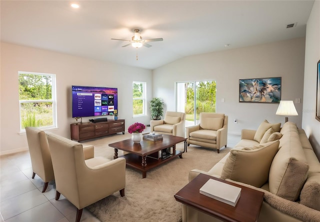 living room with light tile patterned floors, vaulted ceiling, and ceiling fan