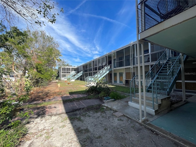 view of yard featuring a sunroom