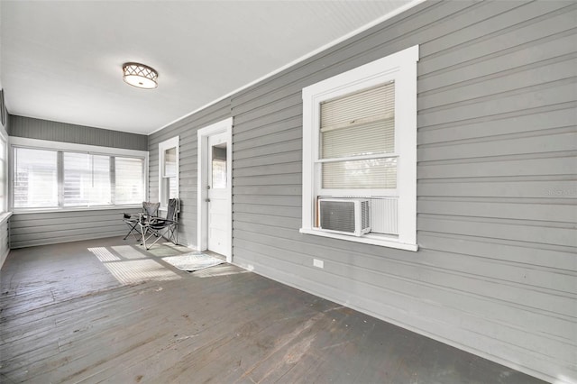 unfurnished sunroom with cooling unit