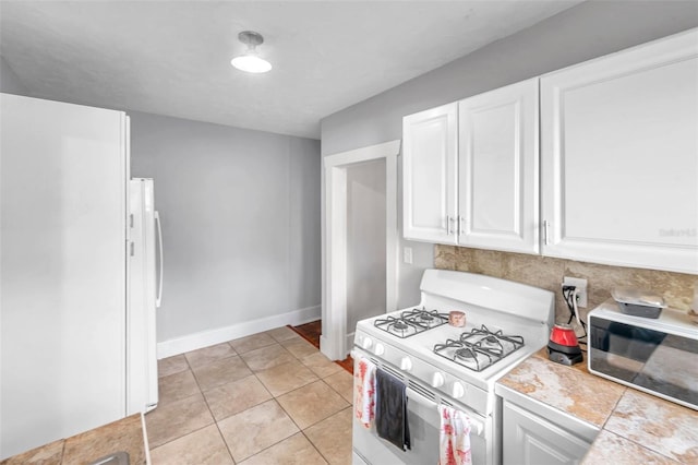 kitchen with tile countertops, white cabinetry, light tile patterned flooring, and white appliances