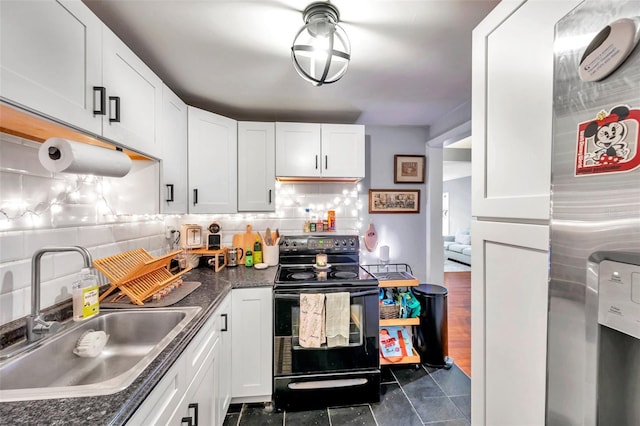 kitchen featuring backsplash, white cabinetry, sink, and black range with electric cooktop