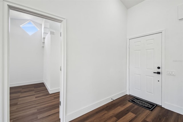 entryway with dark wood-type flooring