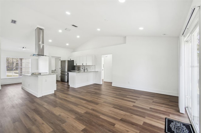 kitchen featuring island range hood, stainless steel fridge, dark hardwood / wood-style flooring, decorative backsplash, and white cabinets