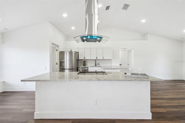 kitchen with a large island with sink, white cabinets, light stone counters, and stainless steel fridge with ice dispenser