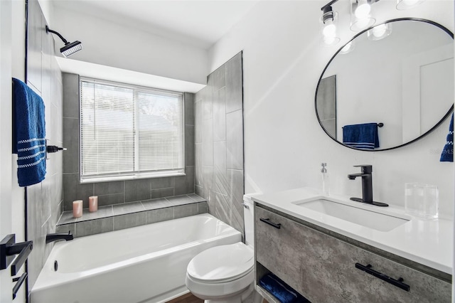 full bathroom with vanity, toilet, and tiled shower / bath combo