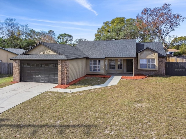 ranch-style home featuring a garage and a front yard