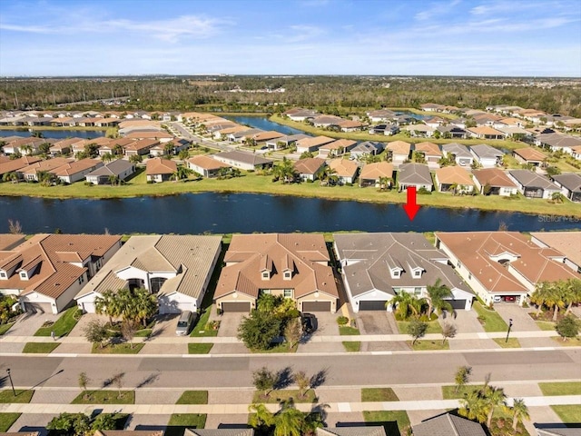 birds eye view of property featuring a water view