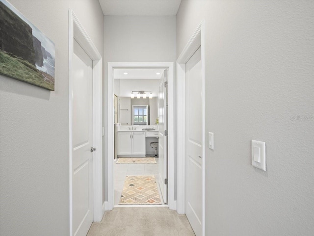 hallway with light carpet