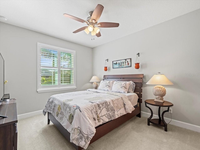 bedroom with light colored carpet and ceiling fan