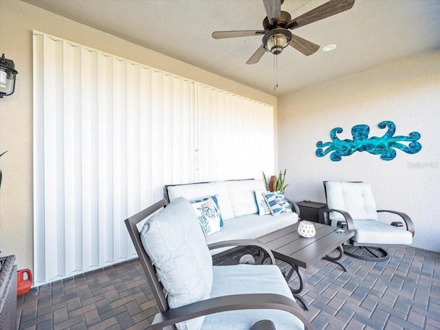 view of patio featuring ceiling fan