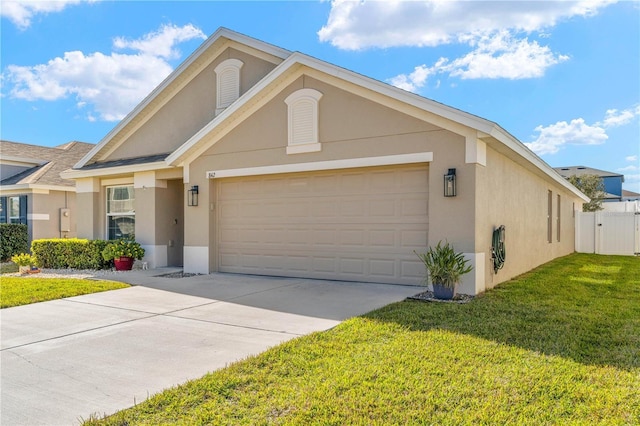 single story home featuring a garage and a front lawn