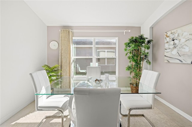 dining space featuring light tile patterned floors