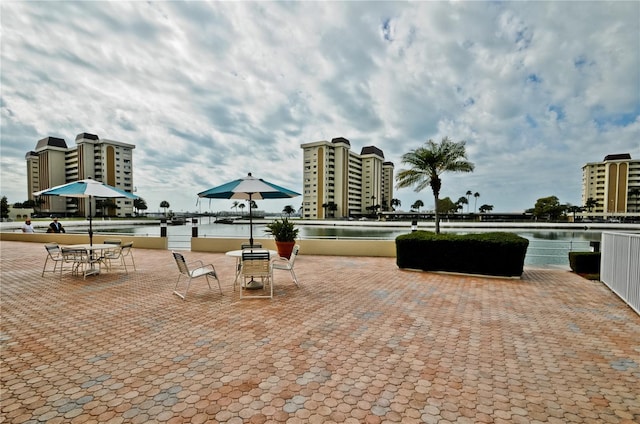 view of patio with a water view