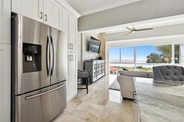 kitchen with white cabinets, crown molding, light stone counters, and stainless steel refrigerator with ice dispenser