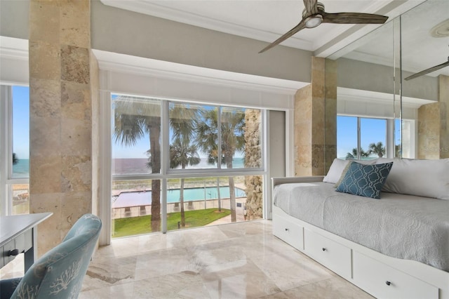 bedroom with multiple windows, a water view, ceiling fan, and crown molding