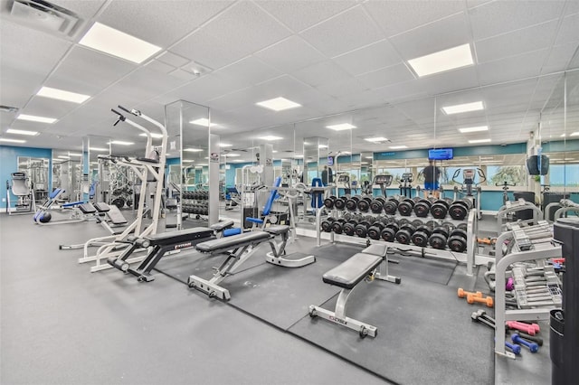 gym featuring a drop ceiling