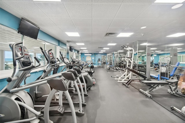 workout area featuring a paneled ceiling