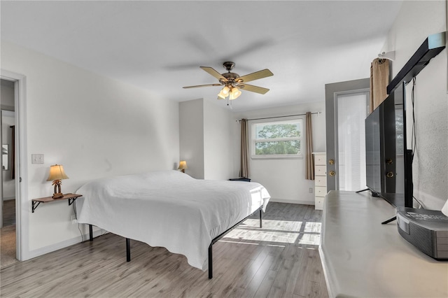 bedroom featuring ceiling fan and light wood-type flooring
