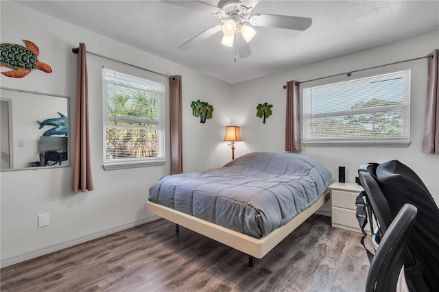 bedroom featuring hardwood / wood-style floors and ceiling fan