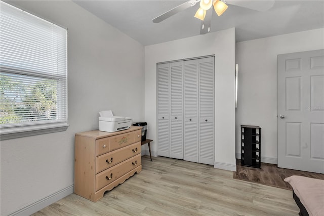 bedroom featuring a closet, ceiling fan, and light hardwood / wood-style floors