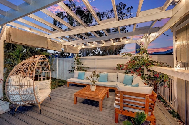 deck at dusk featuring outdoor lounge area and a pergola