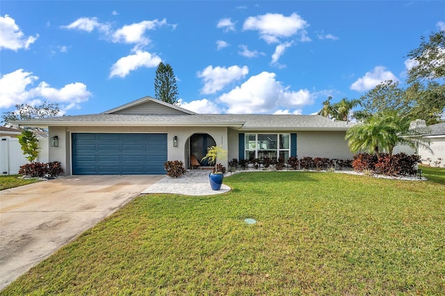 ranch-style house with a front yard and a garage