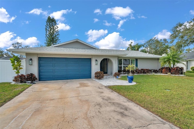 ranch-style house with a front lawn and a garage