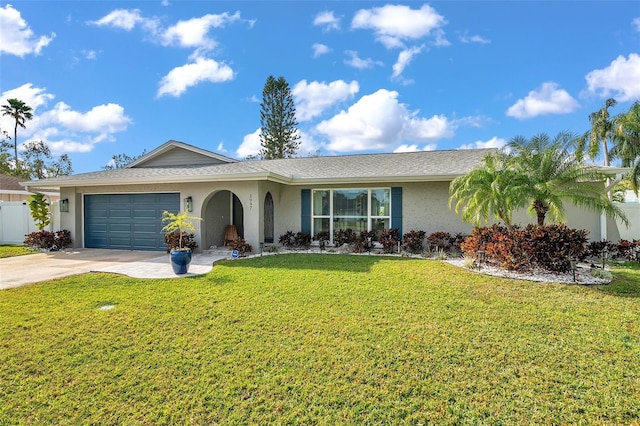 single story home with a garage and a front yard