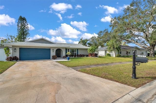 ranch-style house with a garage and a front lawn